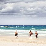 Sunny Byron Bay beach with people in New South Wales, Australia.