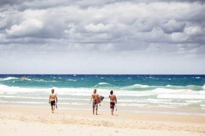 Sunny Byron Bay beach with people in New South Wales, Australia.