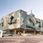 Federation Square bustling with tourists in Melbourne.