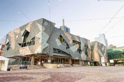 Federation Square bustling with tourists in Melbourne.