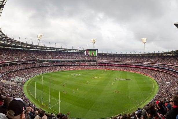 Panoramic view of a packed Melbourne Cricket Ground stadium.
