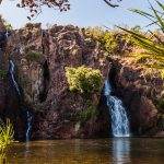 Twin waterfalls in a serene landscape