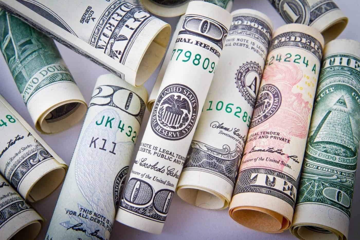 Rolled US dollar bills currency close-up.