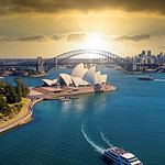 Sydney Opera House and Harbour Bridge at sunset.