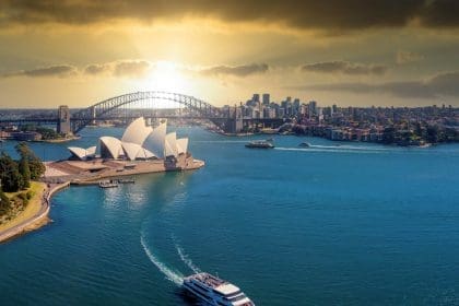 Sydney Opera House and Harbour Bridge at sunset.