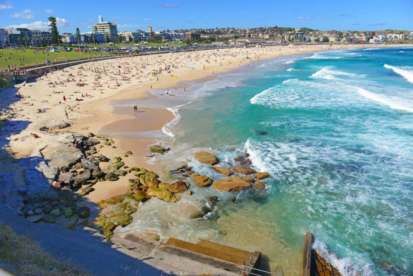 Scenic Bondi Beach coastline with sunbathers in Sydney, Australia.