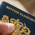 Close-up of British passport cover being held