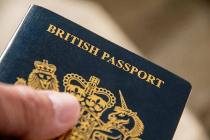 Close-up of British passport cover being held