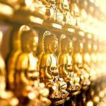 Golden Buddha statues in a row at a temple