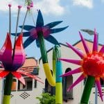 Colorful garden sculptures in a sunny outdoor art installation.