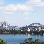 Sydney Harbour Bridge and city skyline view from the river.