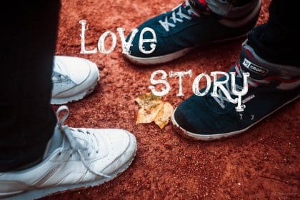 Couples Sneakers with Love Story Text on Ground.