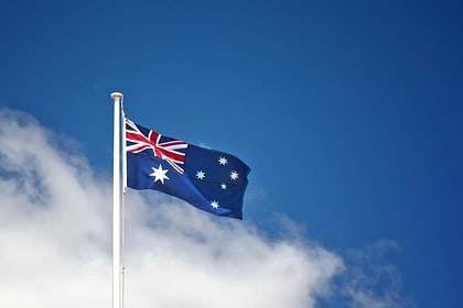 Australian flag waving against blue sky