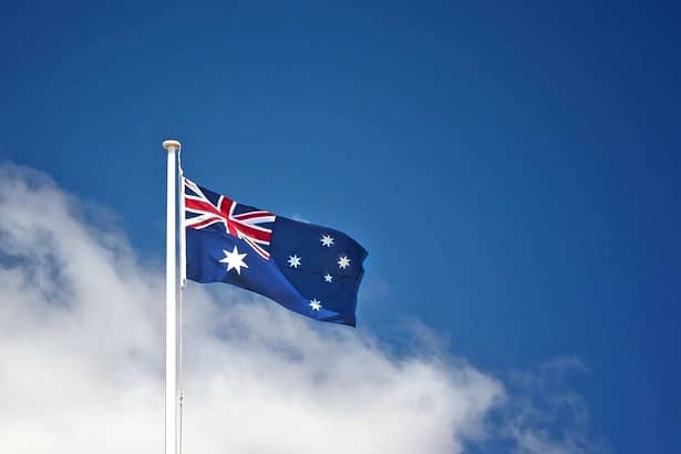 Australian flag waving against blue sky