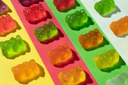 Colorful CBD gummy bears in a row.