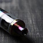 Close-up of electronic cigarette on wooden surface.