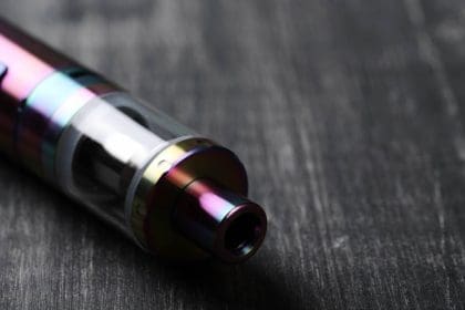 Close-up of electronic cigarette on wooden surface.