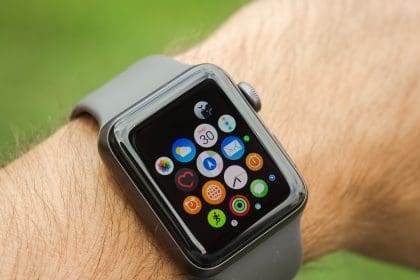 Apple Watch on wrist displaying app icons