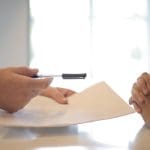 Business contract agreement in office setting