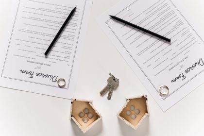 Estate planning documents with keys on a table.