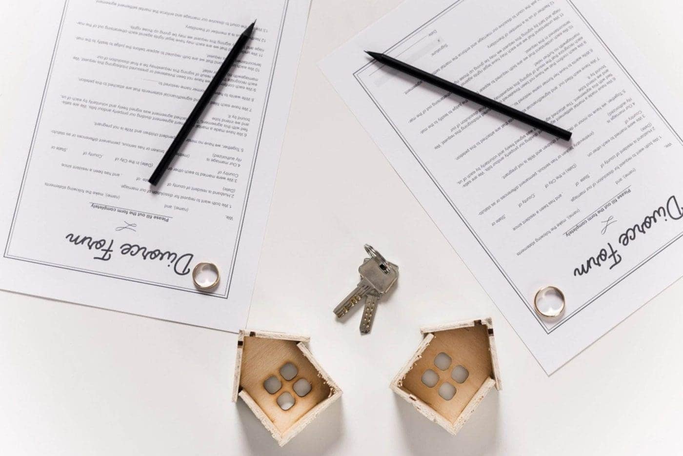 Estate planning documents with keys on a table.