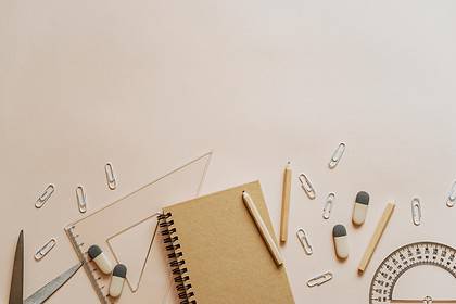 Stationery and school supplies on a desk for education.